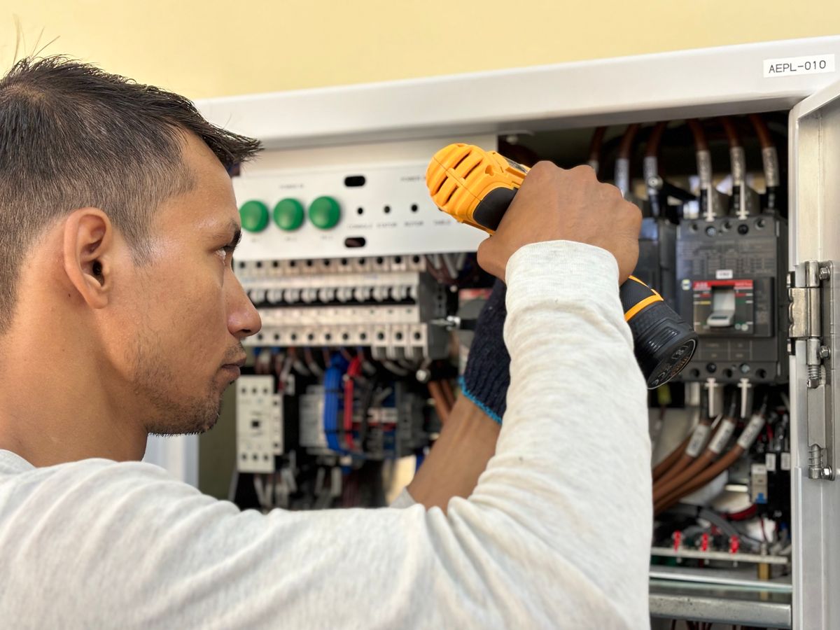 Electrician working on a domestic electrical panel